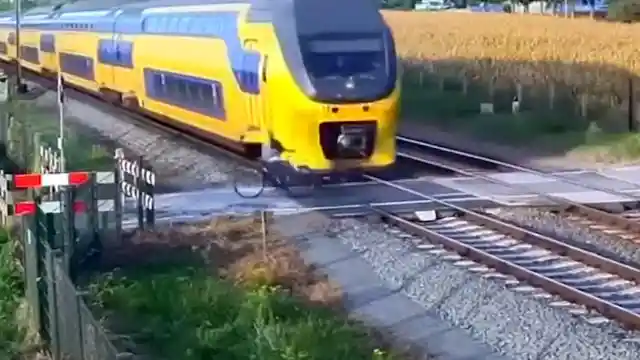 #11. Biker Nearly Hit By Train